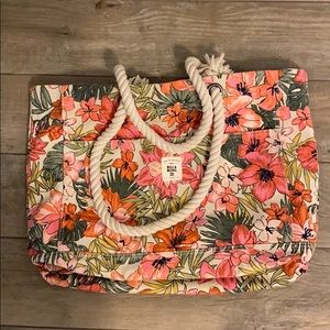 This is a billabong floral pattern beach bag